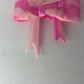 Solid pink swirl silicone bow