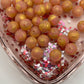15mm peachy pink/gold glitter shiny beads SOLD INDIVIDUALLY!